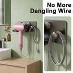 HASTHIP Wall-Mounted Hair Dryer Holder in Carbon Steel with U-Shaped Soft Rubber Support and Cord Hook
