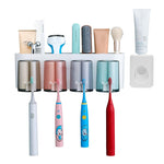 HASTHIP Toothbrush Holder with Toothpaste Dispenser and Adhesive Mount | Holds 4 Brushes & Cups for Family Bathroom Organization