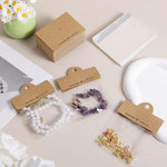 HASTHIP Jewellery Organiser Pouch Set for Rings and Necklaces with 100Pcs 8x10cm Clear Bags | Includes Brown Cardstock Handles for Display and Gifting