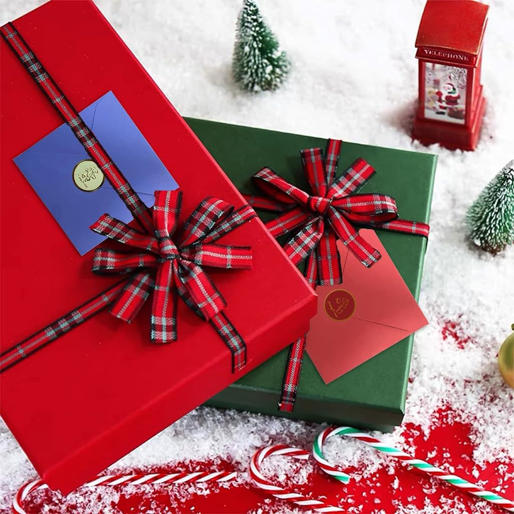 3D Christmas cards beside red and green paper gift boxes, plaid ribbons