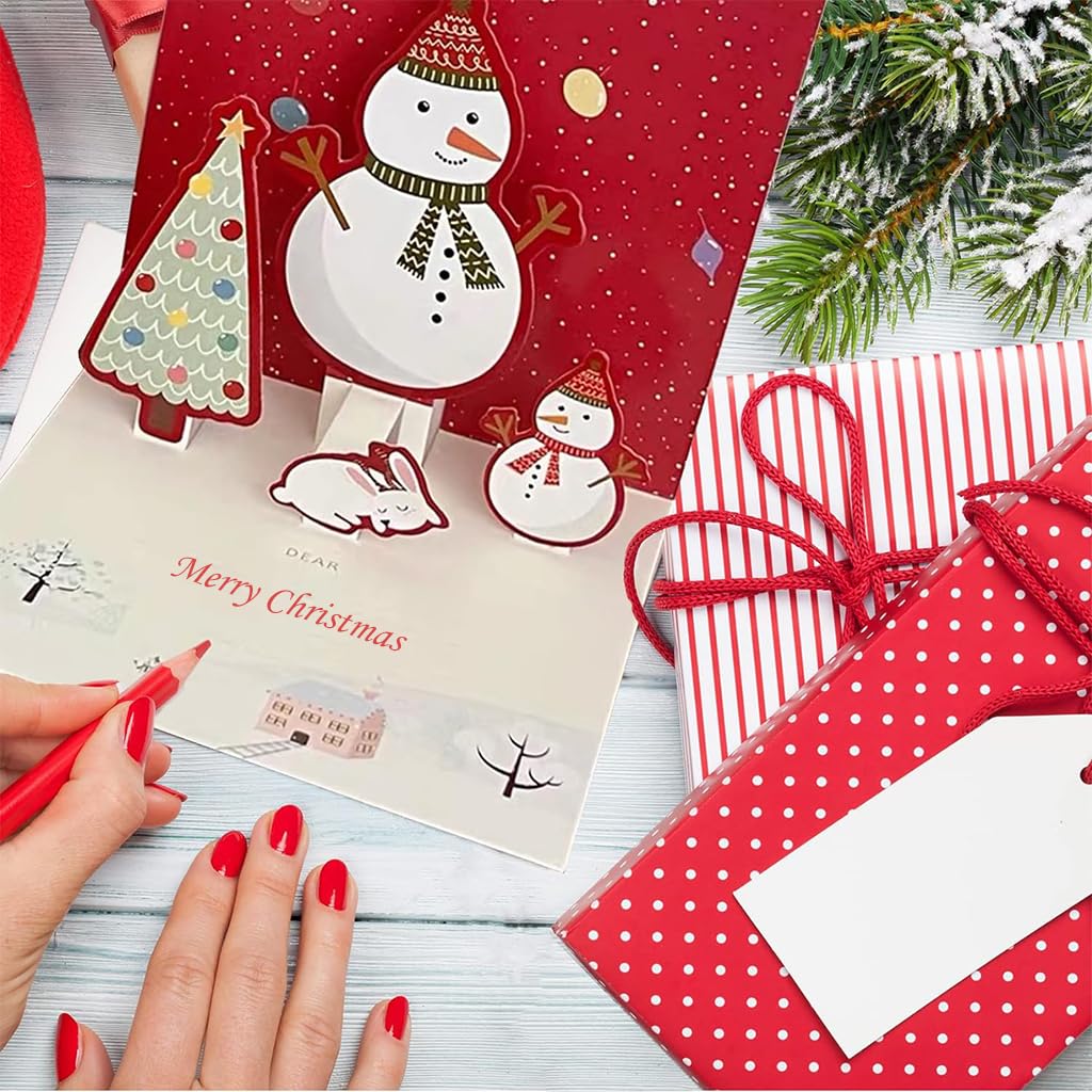 Red paper 3D Christmas cards with pop-up snowmen, home writing scene